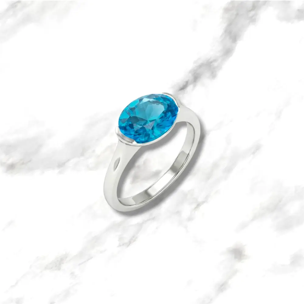 Anello in oro bianco 9kt con topazio azzurro