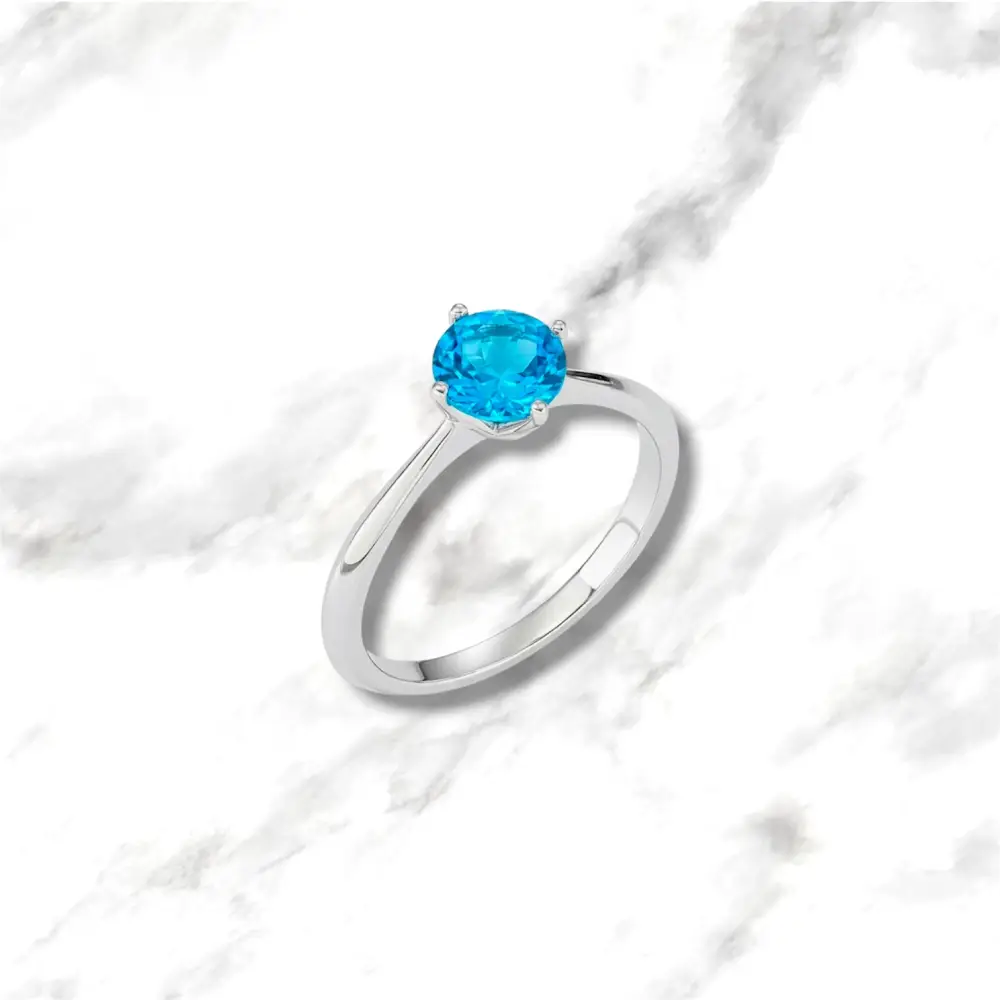 Solitario in oro bianco 9kt con topazio azzurro